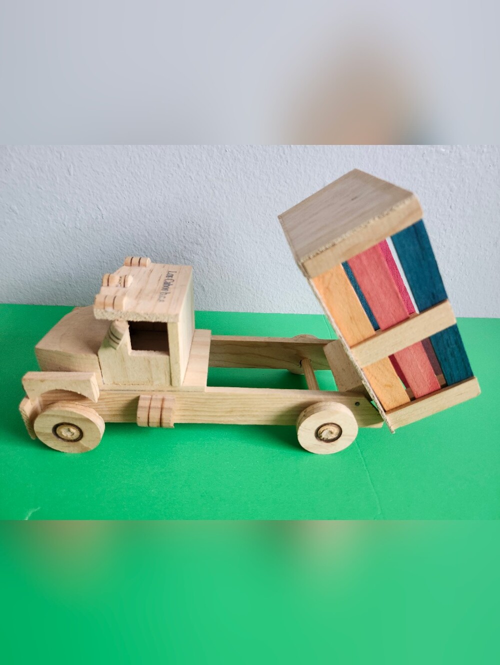 Handcrafted Natural Wood Dump Truck with Color-Striped Bed